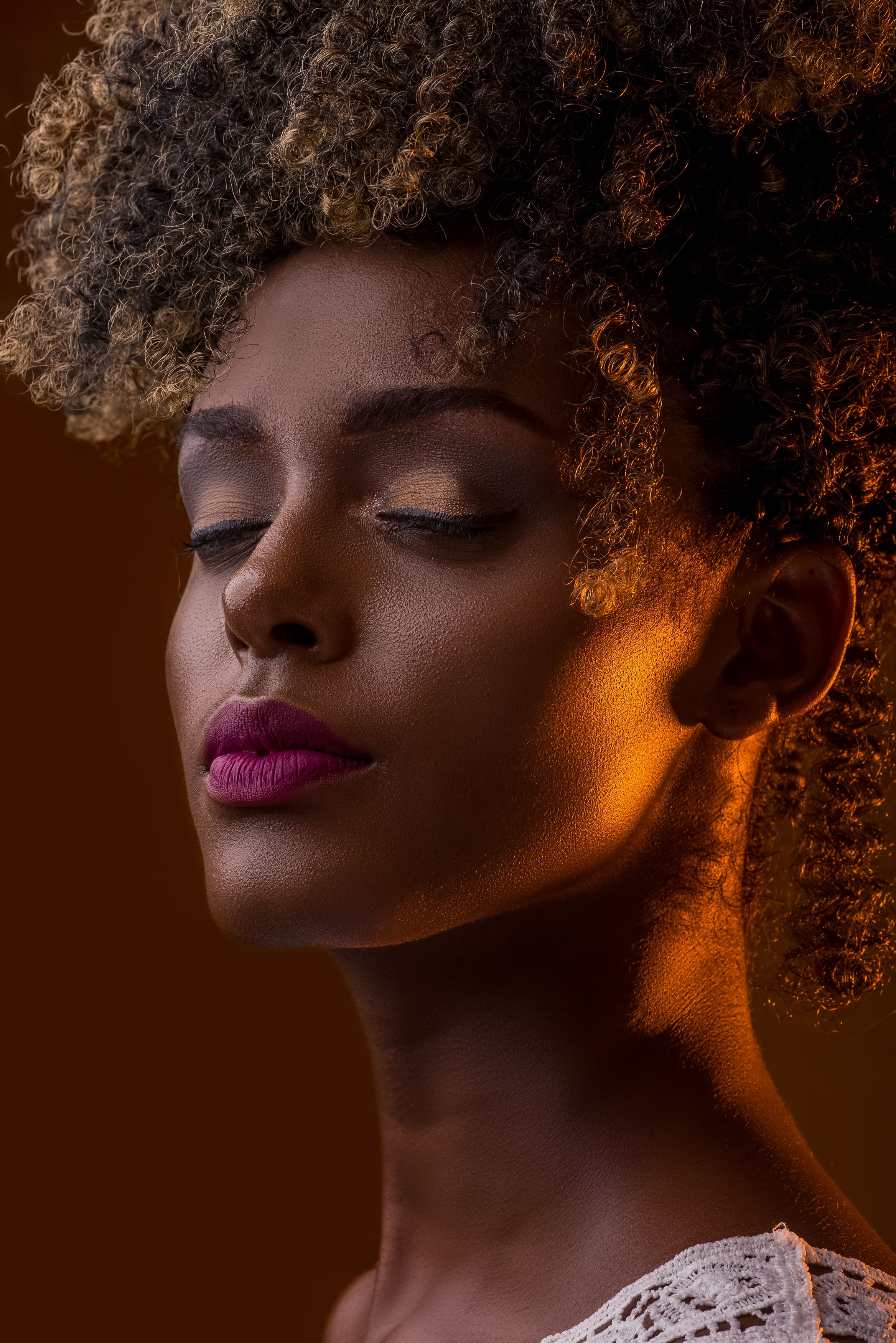 Nigerian woman wearing a sleek Liora Hair frontal wig